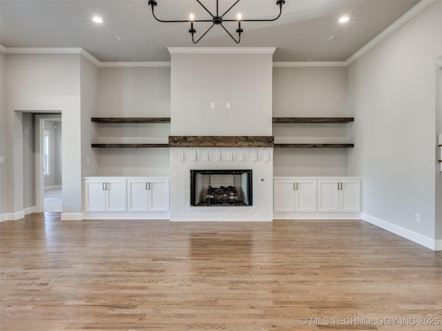 4010 W Baton Rouge St, Broken Arrow, OK 74011 - unfurnished living room with light wood-style floors, crown molding, a chandelier, recessed lighting, and a brick fireplace