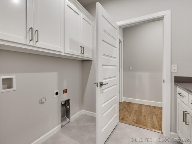 4010 W Baton Rouge St, Broken Arrow, OK 74011 - laundry room with hookup for an electric dryer, cabinet space, washer hookup, and baseboards