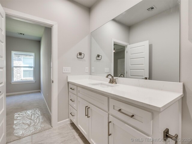 4010 W Baton Rouge St, Broken Arrow, OK 74011 - bathroom featuring vanity and baseboards