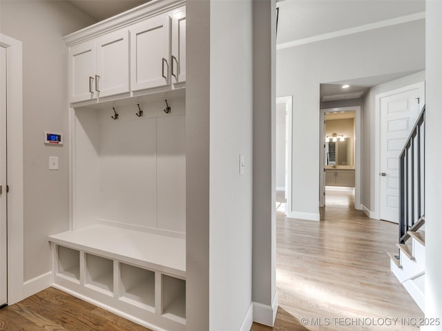 4010 W Baton Rouge St, Broken Arrow, OK 74011 - mudroom with wood finished floors, baseboards, and ornamental molding