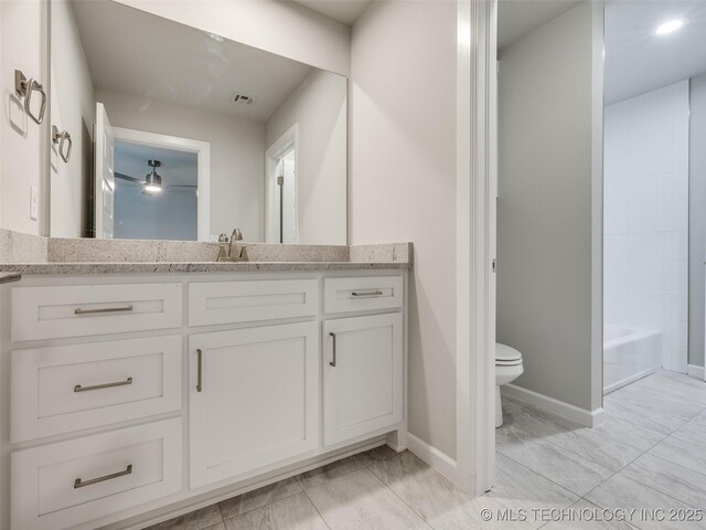 4010 W Baton Rouge St, Broken Arrow, OK 74011 - bathroom with toilet, vanity, and baseboards