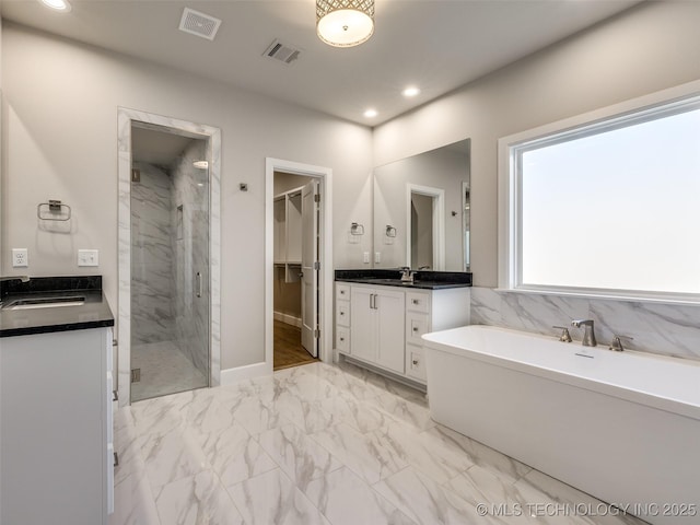 11220 S Fir Ave W, Jenks, OK 74037 - full bath with a marble finish shower, vanity, marble finish floors, a soaking tub, and recessed lighting