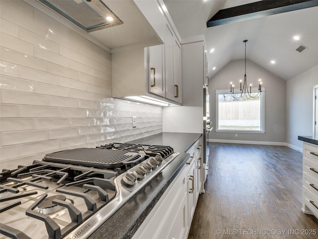 11220 S Fir Ave W, Jenks, OK 74037 - kitchen with stainless steel gas cooktop, dark countertops, tasteful backsplash, lofted ceiling, and dark wood-style floors