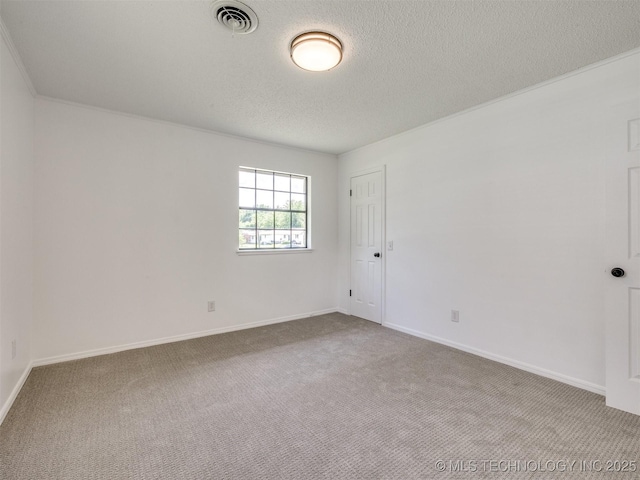 703 NE 8th St, Wagoner, OK 74467 - carpeted spare room with a textured ceiling and baseboards