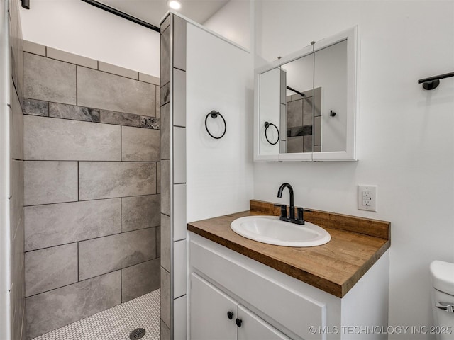 703 NE 8th St, Wagoner, OK 74467 - full bath with vanity, tiled shower, and toilet