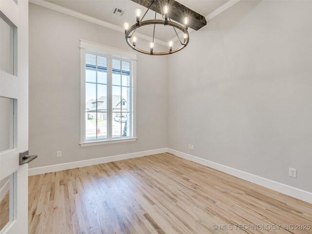 4011 W Baton Rouge St, Broken Arrow, OK 74011 - spare room featuring a chandelier, ornamental molding, wood finished floors, and baseboards