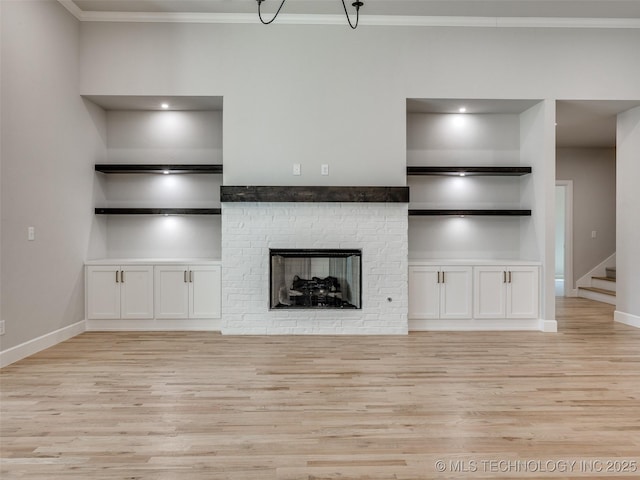 4011 W Baton Rouge St, Broken Arrow, OK 74011 - unfurnished living room with light wood-style floors, ornamental molding, baseboards, and stairway