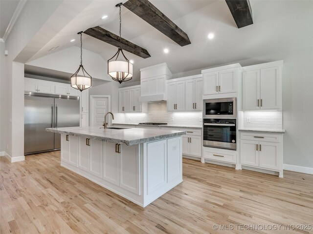 4011 W Baton Rouge St, Broken Arrow, OK 74011 - kitchen with built in appliances, backsplash, white cabinets, light wood finished floors, and baseboards