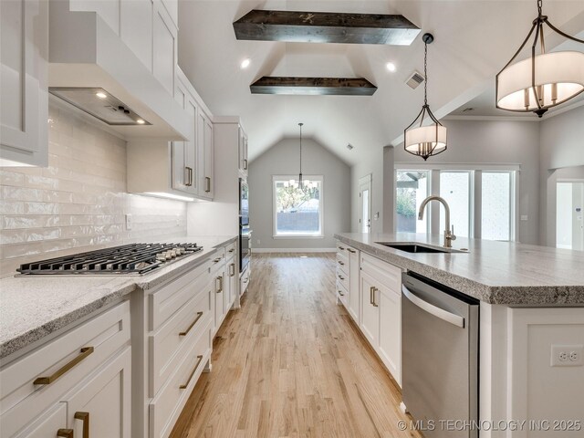 4011 W Baton Rouge St, Broken Arrow, OK 74011 - kitchen with stainless steel appliances, a sink, custom range hood, light wood-type flooring, and a kitchen island with sink