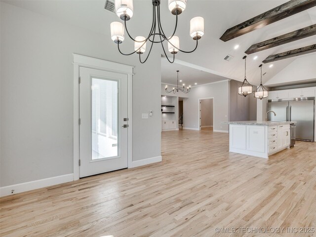 4011 W Baton Rouge St, Broken Arrow, OK 74011 - kitchen featuring a chandelier, built in fridge, open floor plan, white cabinets, and light wood-style floors
