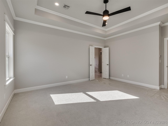 4011 W Baton Rouge St, Broken Arrow, OK 74011 - unfurnished bedroom featuring a tray ceiling, light carpet, crown molding, baseboards, and recessed lighting