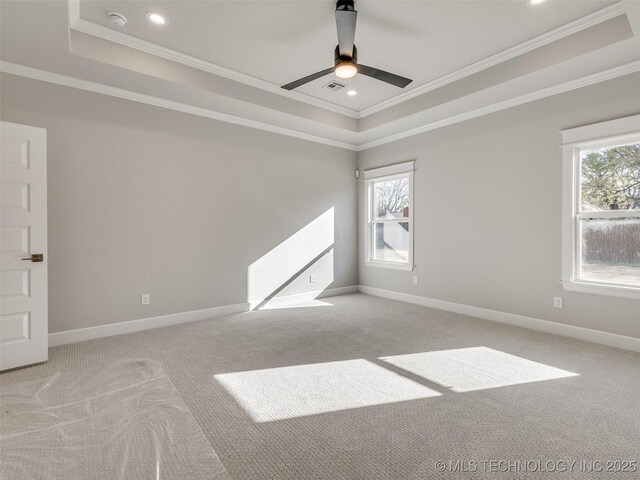 4011 W Baton Rouge St, Broken Arrow, OK 74011 - carpeted spare room featuring a tray ceiling, crown molding, ceiling fan, baseboards, and recessed lighting