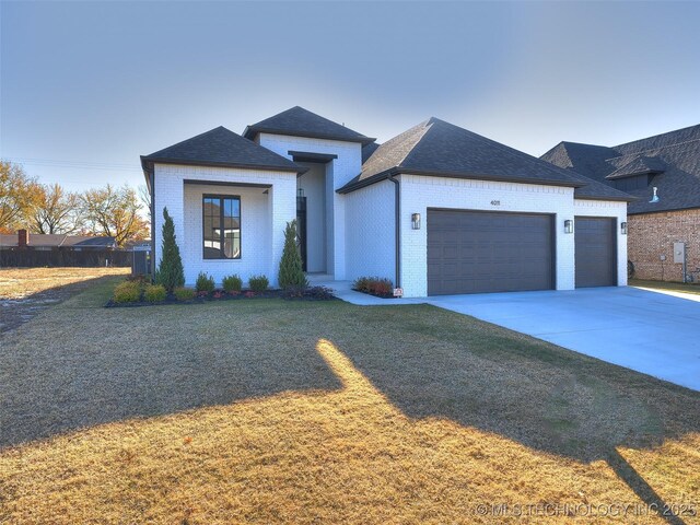 4011 W Baton Rouge St, Broken Arrow, OK 74011 - view of front of home with brick siding, a garage, and roof with shingles