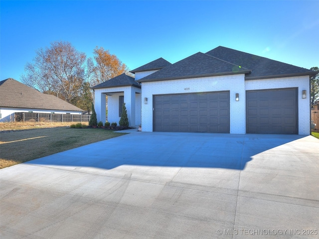 4011 W Baton Rouge St, Broken Arrow, OK 74011 - view of front of property featuring brick siding, an attached garage, roof with shingles, and driveway
