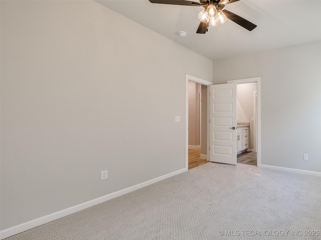 4011 W Baton Rouge St, Broken Arrow, OK 74011 - unfurnished bedroom with light carpet, baseboards, a ceiling fan, and ensuite bathroom