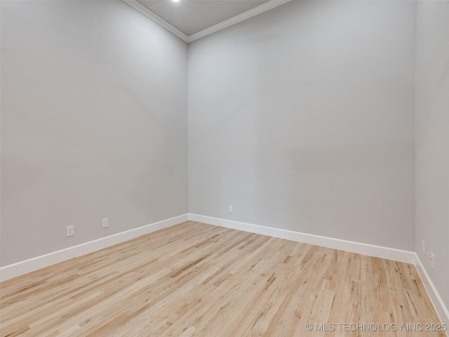 4011 W Baton Rouge St, Broken Arrow, OK 74011 - spare room with crown molding, baseboards, and wood finished floors
