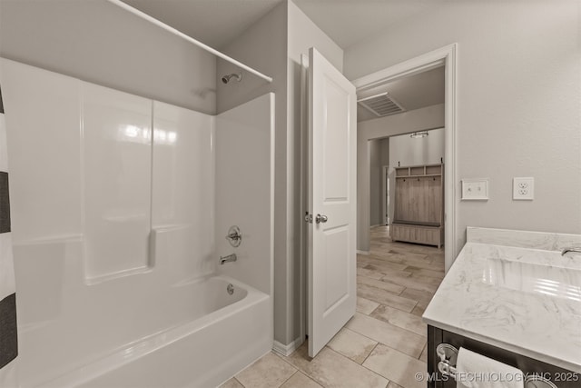 13010 E 122nd Pl, Collinsville, OK 74021 - bathroom featuring vanity, washtub / shower combination, and tile patterned floors