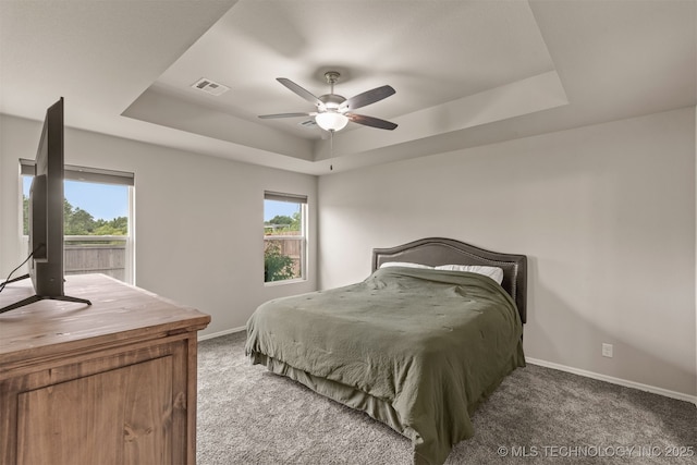 13010 E 122nd Pl, Collinsville, OK 74021 - bedroom with a raised ceiling, carpet floors, baseboards, and multiple windows