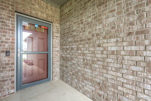 13010 E 122nd Pl, Collinsville, OK 74021 - property entrance featuring brick siding
