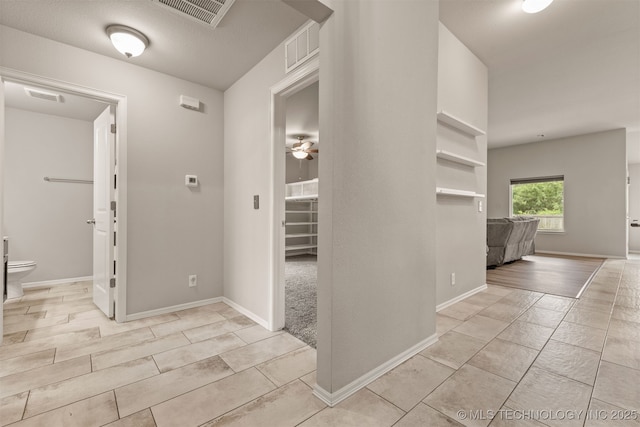 13010 E 122nd Pl, Collinsville, OK 74021 - hall featuring baseboards and light tile patterned floors