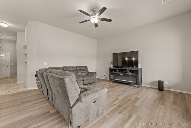13010 E 122nd Pl, Collinsville, OK 74021 - living room with ceiling fan, light wood-style flooring, and baseboards