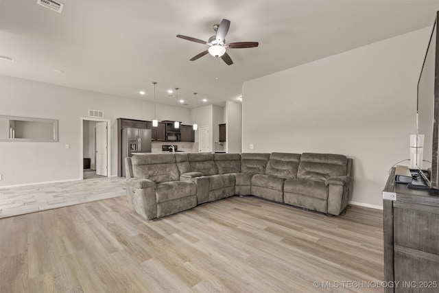 13010 E 122nd Pl, Collinsville, OK 74021 - living room with ceiling fan, light wood-style floors, baseboards, and recessed lighting
