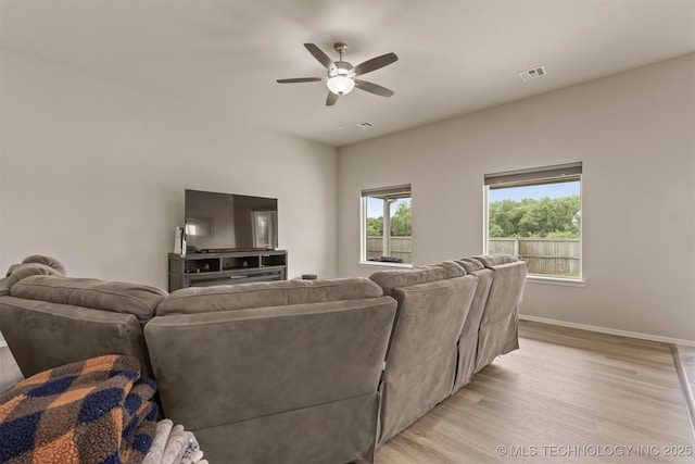 13010 E 122nd Pl, Collinsville, OK 74021 - living room with ceiling fan, light wood-style flooring, and baseboards