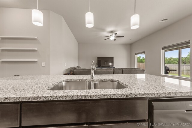 13010 E 122nd Pl, Collinsville, OK 74021 - kitchen with a sink, ceiling fan, light stone counters, and open floor plan