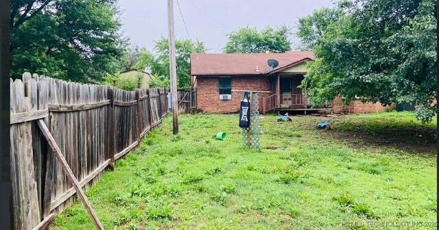 920 N Woodview Dr, Skiatook, OK 74070 - back of house with brick siding