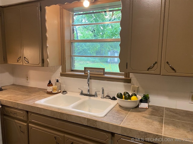 305 N 10th St, Hartshorne, OK 74547 - kitchen with tasteful backsplash, tile countertops, and gray cabinets