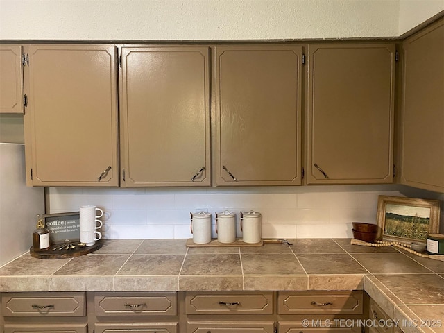 305 N 10th St, Hartshorne, OK 74547 - kitchen featuring tasteful backsplash and gray cabinetry