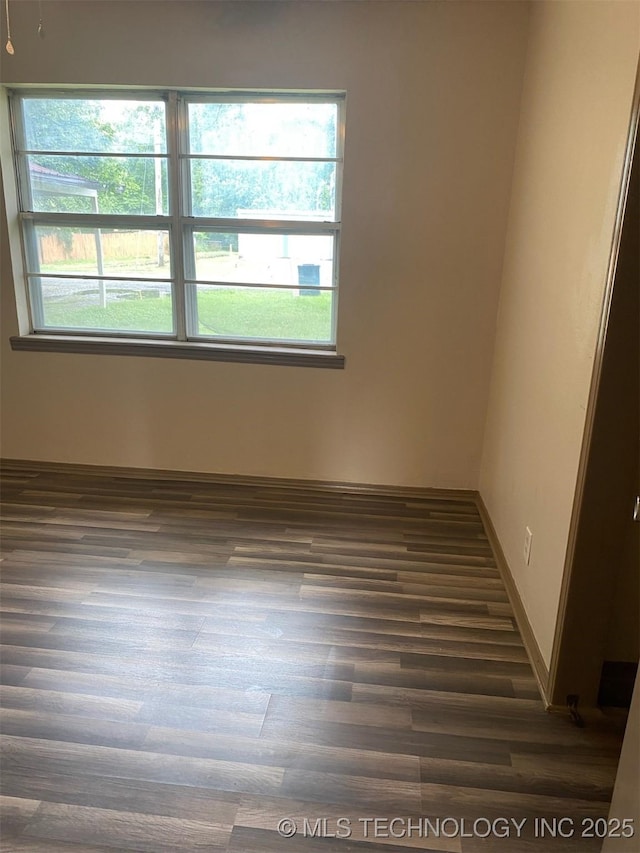 305 N 10th St, Hartshorne, OK 74547 - empty room featuring dark wood-style floors