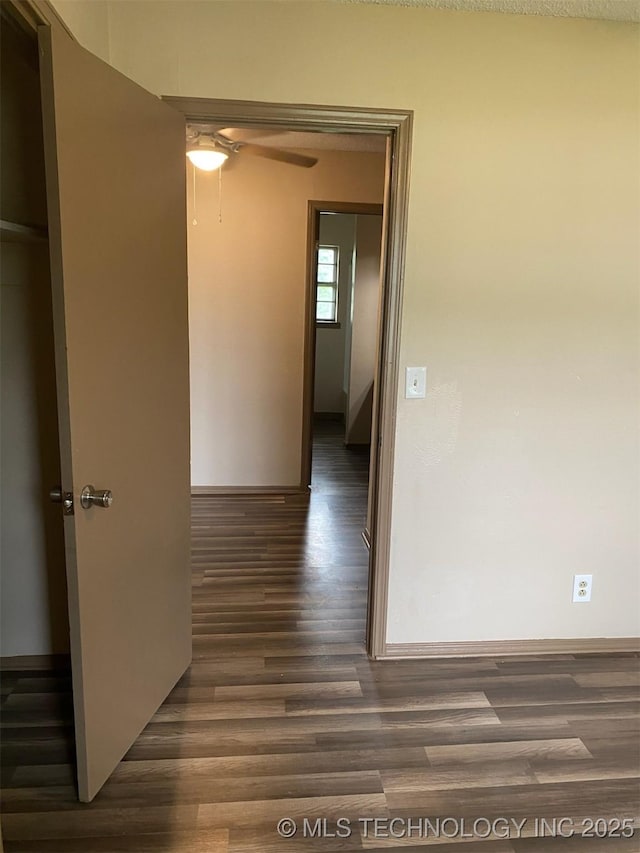 305 N 10th St, Hartshorne, OK 74547 - hallway with wood finished floors and baseboards
