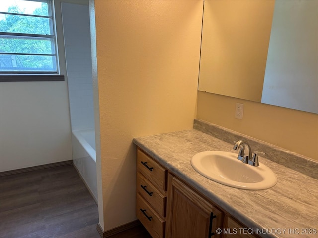 305 N 10th St, Hartshorne, OK 74547 - full bathroom featuring vanity and wood finished floors