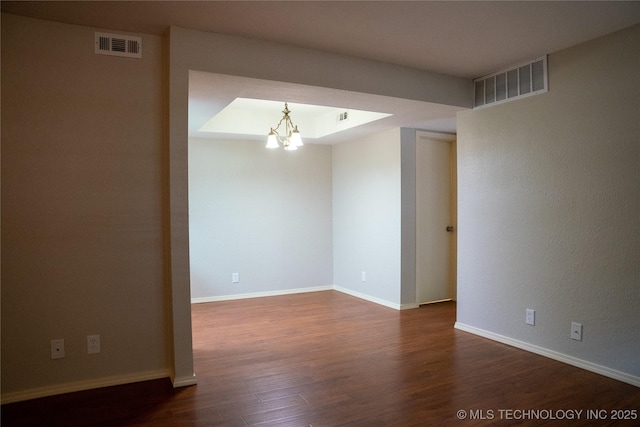 9113 S Urbana Ave Unit 8, Tulsa, OK 74137 - empty room with a chandelier, dark wood finished floors, and baseboards