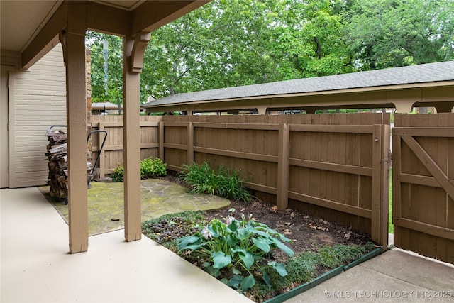 9113 S Urbana Ave Unit 8, Tulsa, OK 74137 - view of patio / terrace featuring a gate