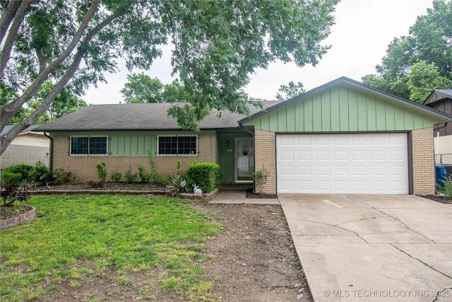 11612 E 28th St, Tulsa, OK 74129 - single story home with brick siding, driveway, and a garage