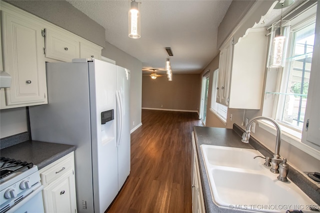 11612 E 28th St, Tulsa, OK 74129 - kitchen featuring a sink, dark countertops, and plenty of natural light
