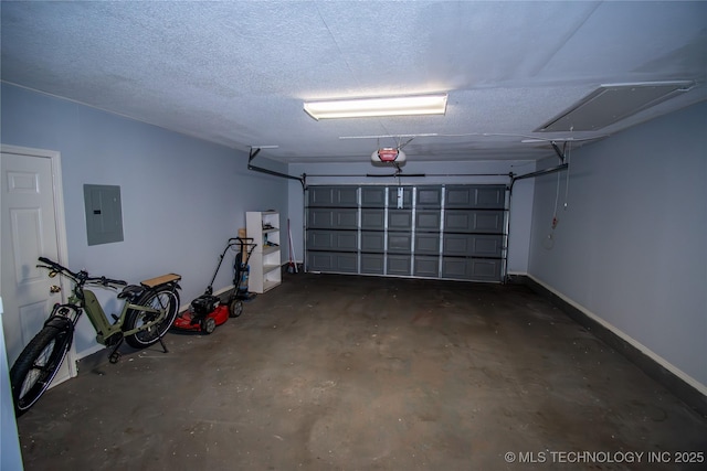 11612 E 28th St, Tulsa, OK 74129 - garage featuring electric panel, a garage door opener, and baseboards