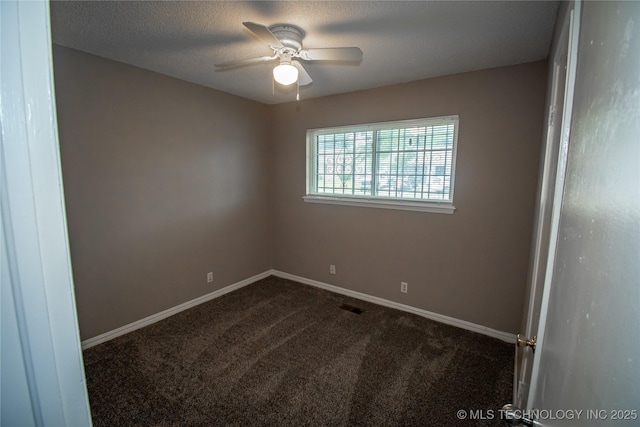11612 E 28th St, Tulsa, OK 74129 - spare room featuring dark colored carpet, a ceiling fan, baseboards, and a textured ceiling