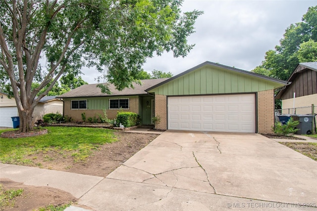 11612 E 28th St, Tulsa, OK 74129 - single story home with brick siding, driveway, and an attached garage