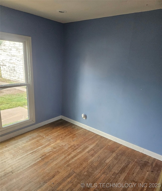 737 W Doolin Ave, Blackwell, OK 74631 - empty room featuring wood-type flooring and baseboards