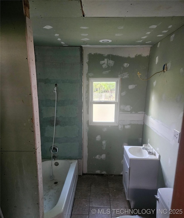 737 W Doolin Ave, Blackwell, OK 74631 - full bath featuring vanity, toilet, and tile patterned flooring