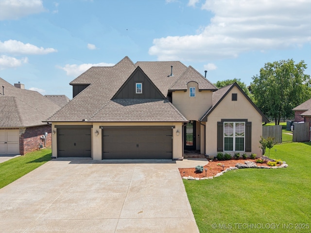 16210 E 49th St, Tulsa, OK 74134 - view of front of property featuring a garage, driveway, a shingled roof, and stucco siding