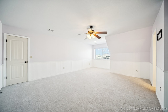 16210 E 49th St, Tulsa, OK 74134 - unfurnished room featuring carpet floors, ceiling fan, and a wainscoted wall