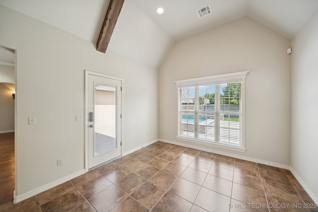 16210 E 49th St, Tulsa, OK 74134 - unfurnished room with vaulted ceiling, arched walkways, and baseboards