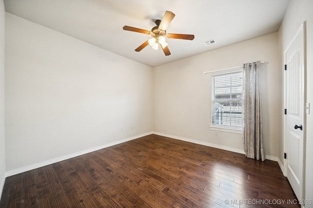 16210 E 49th St, Tulsa, OK 74134 - empty room featuring a ceiling fan, dark wood-type flooring, and baseboards