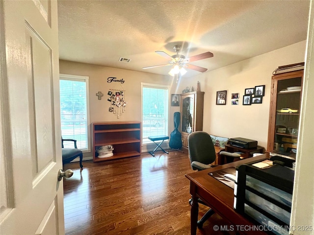 1403 NW Mimosa Cir, Stigler, OK 74462 - home office with wood finished floors, a ceiling fan, and a textured ceiling
