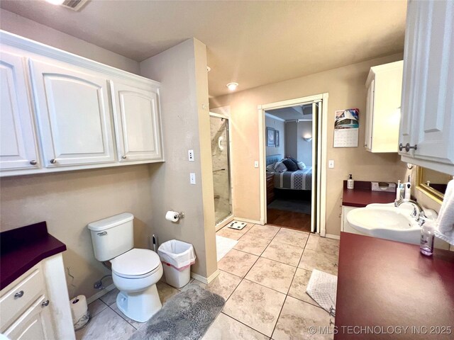 1403 NW Mimosa Cir, Stigler, OK 74462 - full bath with vanity, a stall shower, toilet, tile patterned flooring, and baseboards