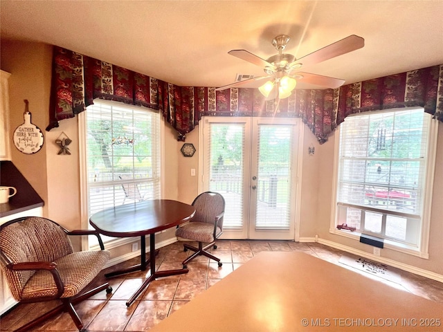 1403 NW Mimosa Cir, Stigler, OK 74462 - dining space with ceiling fan, baseboards, and light tile patterned flooring